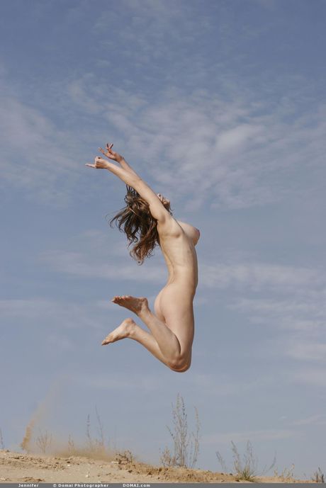 Domai: Gorgeous teen Jennifer exhibits her big tits and hot ass on a sandy beach