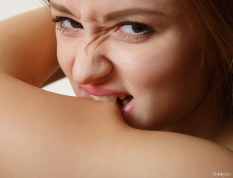 Asian teen Marcy Cat gets naked in a pair of knee socks during solo action