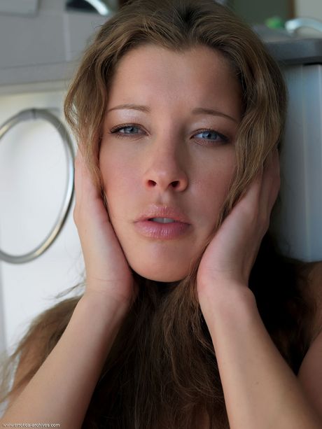 Laetitia displays her big tits and sweet pussy as she poses on the table