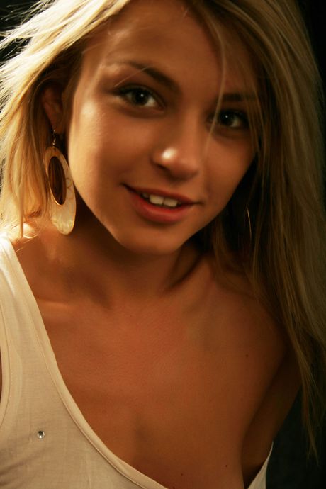 Blonde teen Katy N gets naked in knee socks and heels