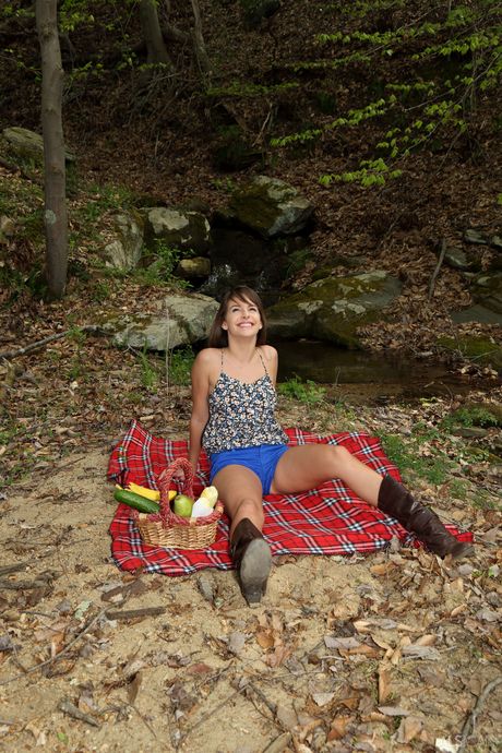 Svelte teenage brunette with tiny tits posing naked outdoor