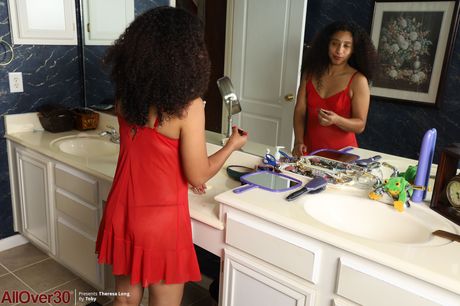 Curly-haired MILF Theresa Long shows her hairy pussy in the bathroom