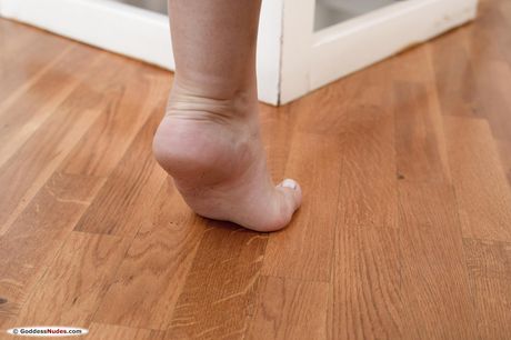 Lilly Bella takes off her lingerie and poses naked on the bed