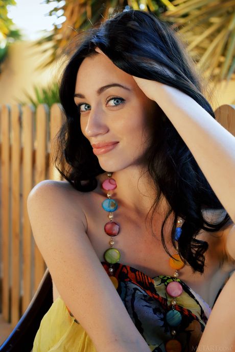 Slender teen Zsanett Tormay removes a sarong to pose nude with self-assuredness