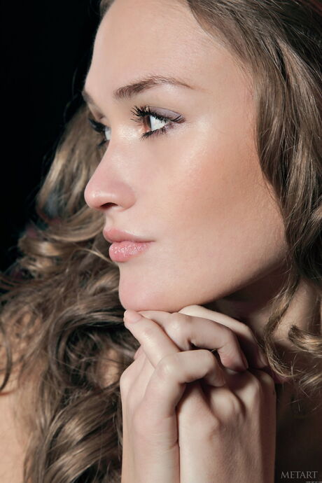 Pretty teen Emilia A removes her lingerie and thong to pose nude