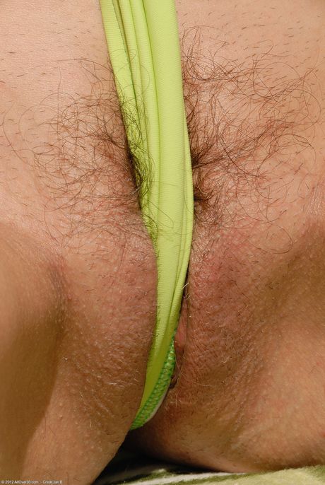 Mature redhead Jenny H shows her saggy tits and mature pussy outdoors