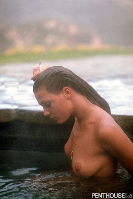 Penthouse Gold: Sexy centerfold Delia Cosner flaunts her oily body and nice tits outdoors