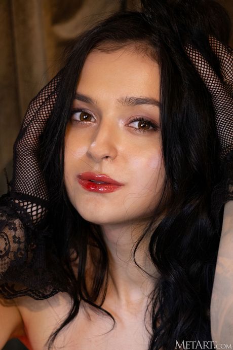 Cute teen Anthea removes fishnet stockings to get totally naked