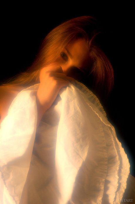 Ukrainian cutie Vika AC removes her lingerie and oils her body