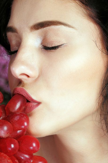 Desirable teen Callista B removes her dress and panties to pose nude