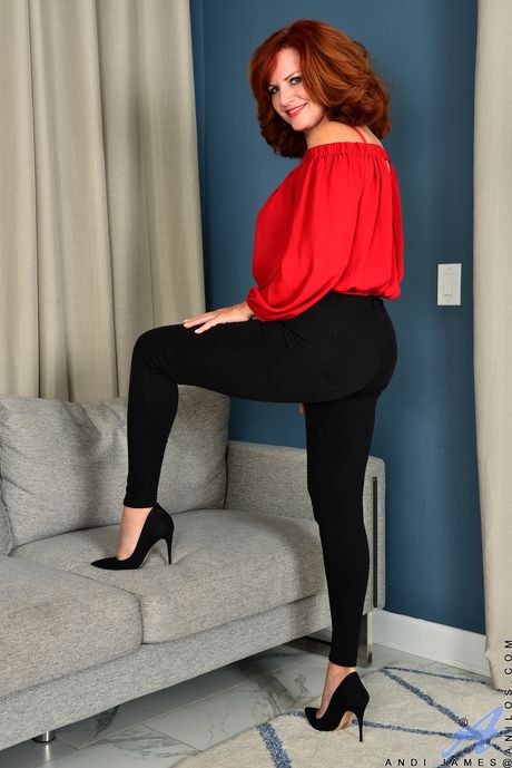 Redheaded MILF Andi James shows her hairy pussy in high heels