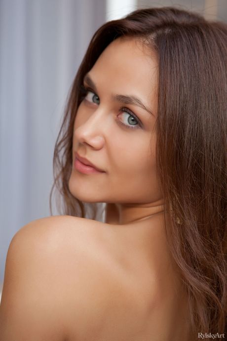 Cute teen girl Zlatka shows off her tiny tits and bald pussy in the nude