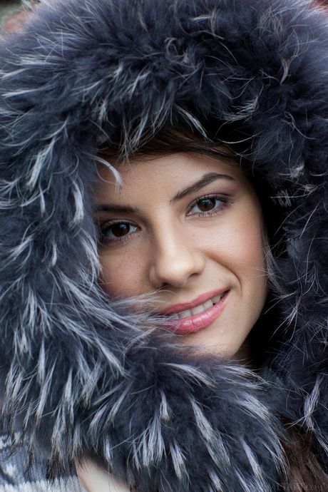 Alluring brunette Swan A reveals her big tits and bald pussy