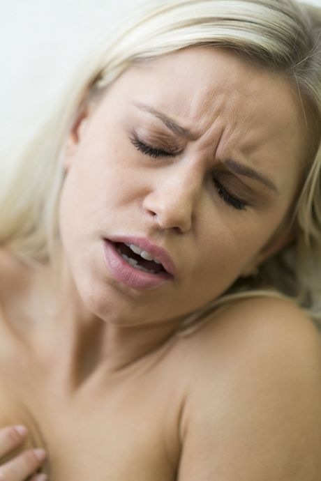 Blonde teen Dido plays with her pussy while naked in a dungeon