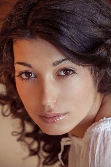 Stunning teen Elyse removes her lingerie and reveals her big tits and twat