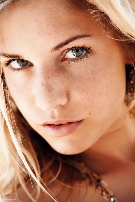 Thin teen Iveta reveals her small tits and hot ass in the garden