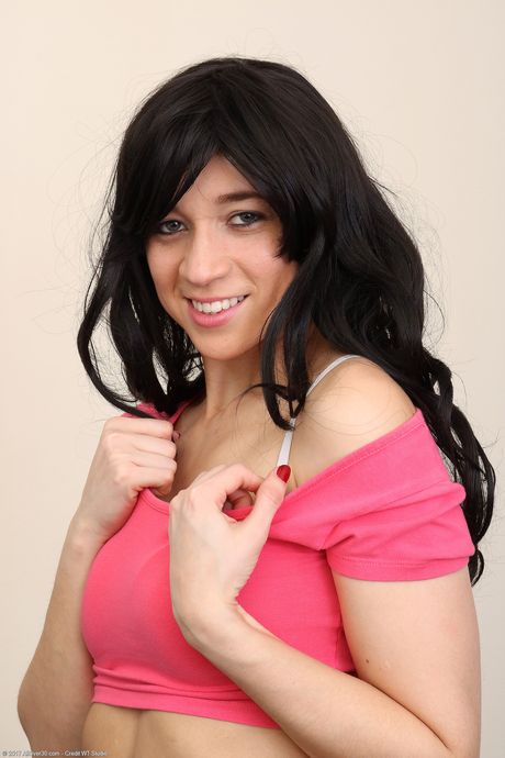 30 plus female Tracy Rose goes naked on a bed in a pair of high heels