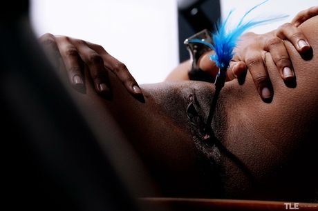 Ebony teen Samantha A removes her braided pigtails before masturbating