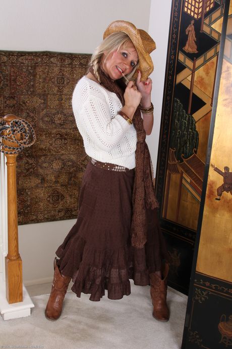 Mature blonde Sherri Donovan shows her big ass and tasty pussy