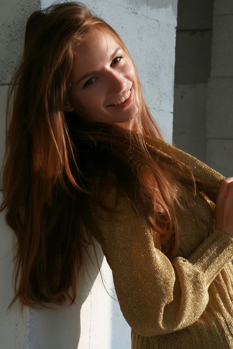 Attractive teen Sofi Shane pours hot wax over her hairy pussy in the backyard