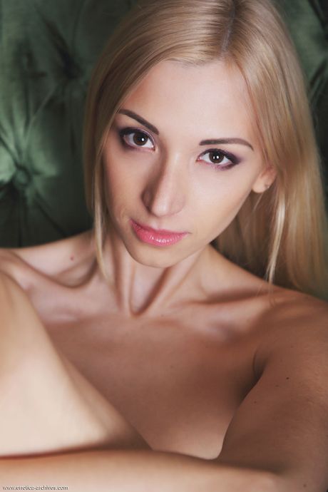 Blonde teen Anna Lee strips off on a chair during solo action