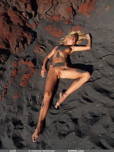 Nice young girl Judit models totally naked in a forest