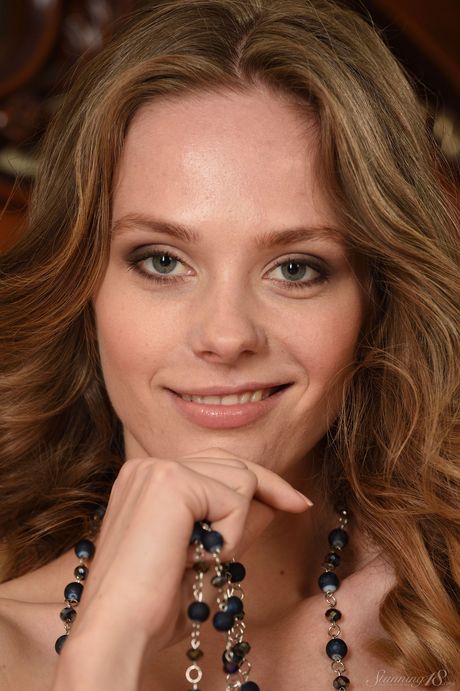 Lean teen Irene strips naked and teases with her tiny tits and sexy feet