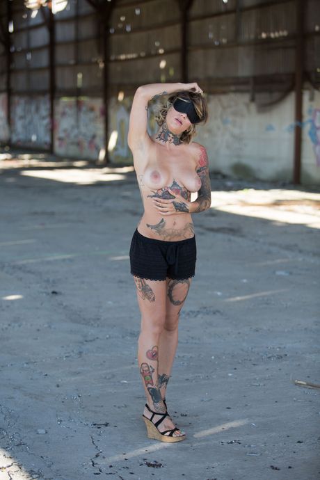 Stacy Cloud strips outdoors and exposes her tattooed body
