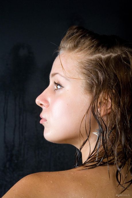 Nice teen Eliane A removes a bikini to get totally naked on a bed