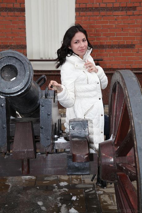 Pretty teen Fox A removes her boots and dress to pose nude