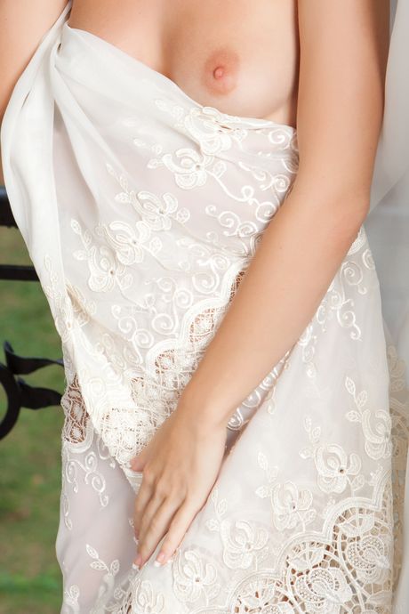 Natural redhead Night A gets totally naked on a patio with conviction