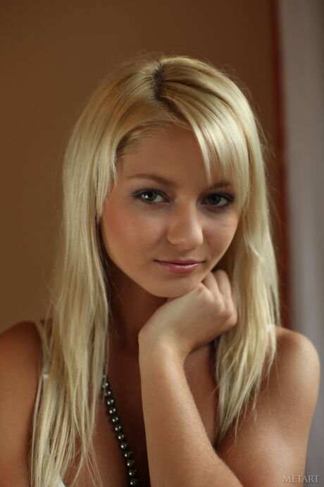 Blonde teen Grace C removes her lingerie to pose nude in high heels