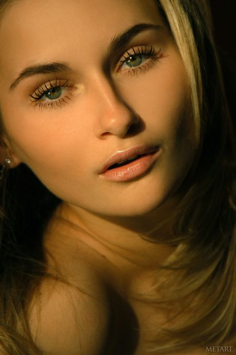 Ukrainian belle Katya D gets naked in an enticing manner