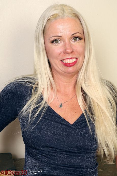 Mature blonde Beth shows off her big ass and her hairy mature pussy