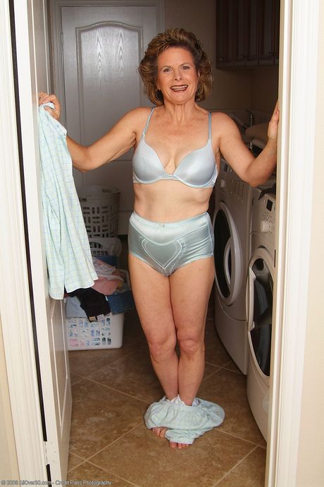 Mature housewife Judy shows off her big ass and hairy pussy