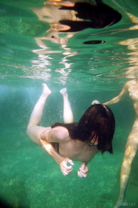 Naked teen girls Kseniya B & Nicole B pose for a nude shoot in a river