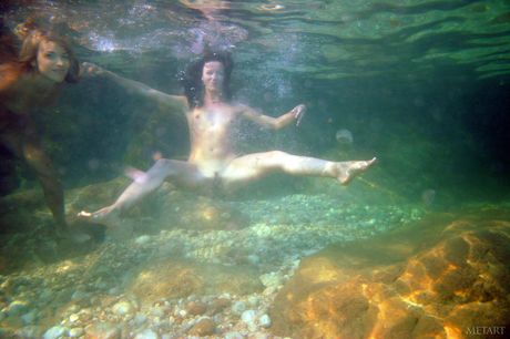 Naked teen girls Kseniya B & Nicole B pose for a nude shoot in a river