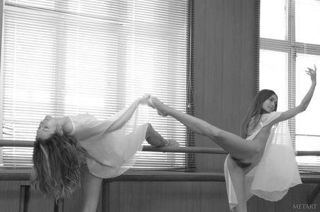 Ukrainian erotic model Jasmine A and her girlfriend Uliya E pose nude in a dance studio
