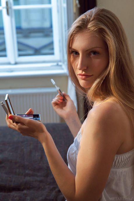 Blonde teen Bretona shows her big tits and poses naked