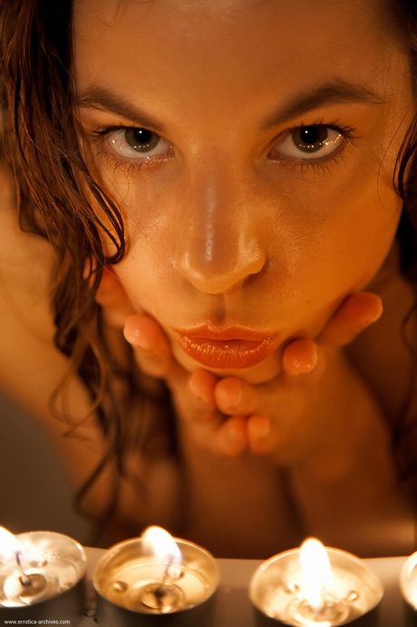 Cute teen Antea removes her bathrobe to pose nude in the bathroom