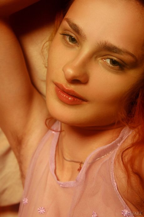 Ukrainian beautiful Olya B gets naked in a pair of white socks