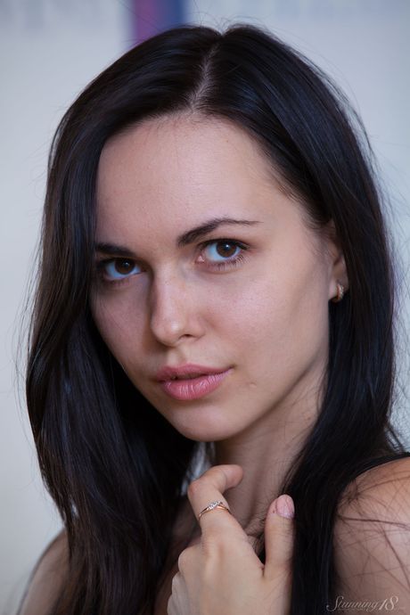 Ukrainian venus Jill strips and plays with her pink pussy in a solo