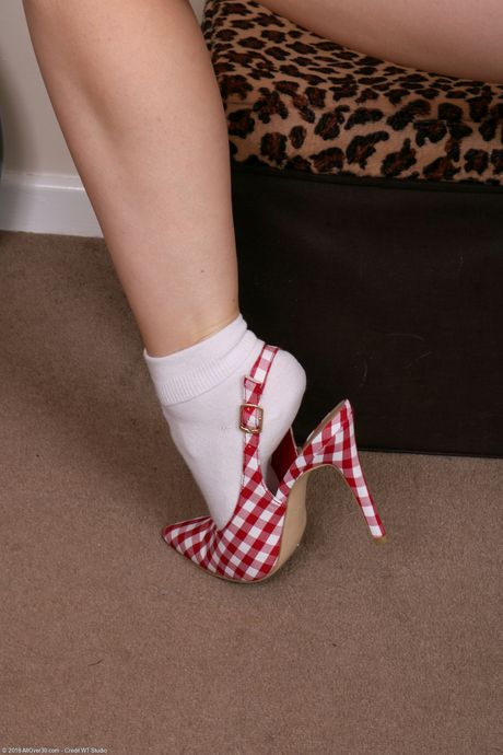 Mature secretary Cherri strips at work & shows her pierced pussy up close