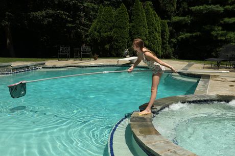 Petite teenage brunette with pigtails posing naked and pissing