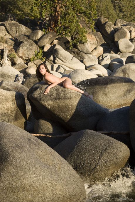 Naked teen Oleen strikes great solo poses on a patio in the nude