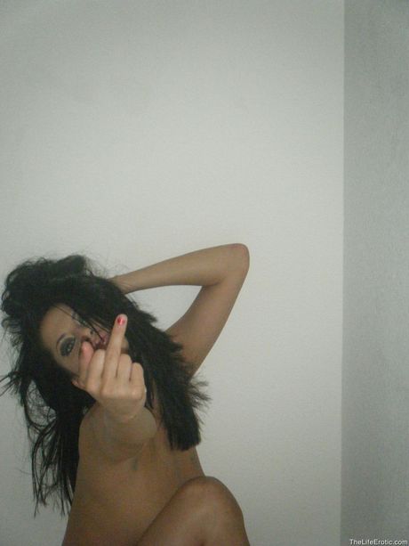 Desirable teen Cassidey removes her lingerie before fingering her pussy on a bed