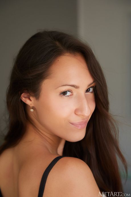 Cute teen Mishel Dark removes her lingerie and heels to get naked on a bed