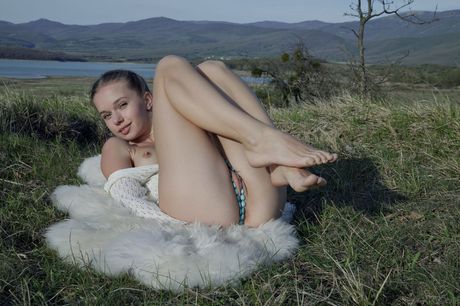 Slender teen Milena D strips her clothes & plays with her hairy pussy outdoors