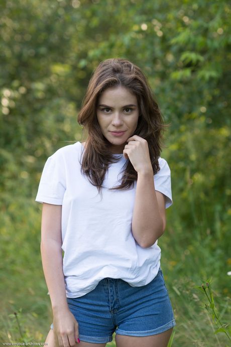 Errotica Archives: Petite teen Leda strips and goes naked in the forest