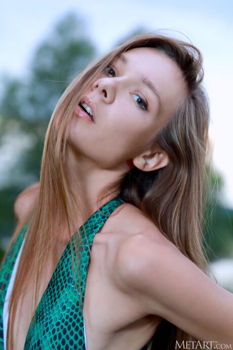 Skinny teen Mirabella strips naked & shows her tiny tits in the countryside